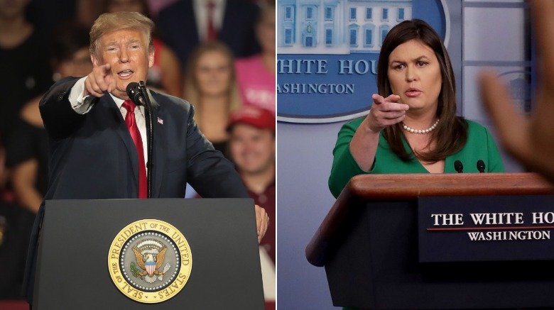 Donald Trump y Sarah Huckabee Sanders