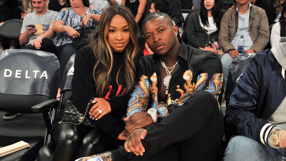 Malika Haqq y O.T. Genasis sentado en un evento