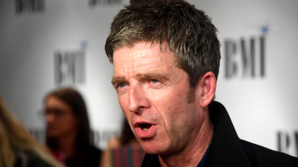 Noel Gallagher speaking at a red carpet event 