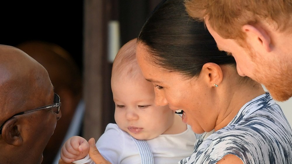 Archie and Meghan Markle, center