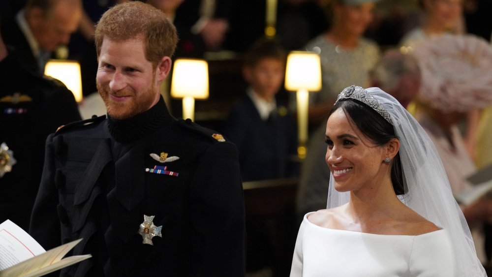 Príncipe Harry, Meghan Markle sonriendo durante su ceremonia de boda