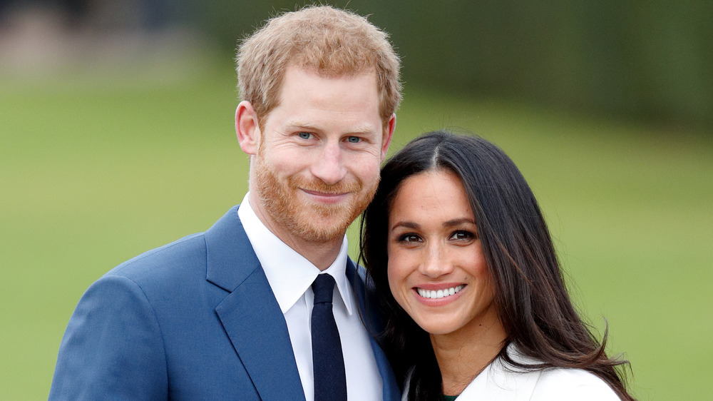 El príncipe Harry y Meghan Markle sonriendo