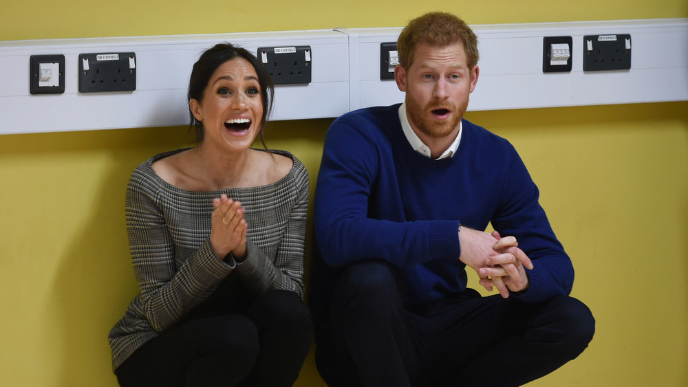 El príncipe Harry y Meghan Markle riendo