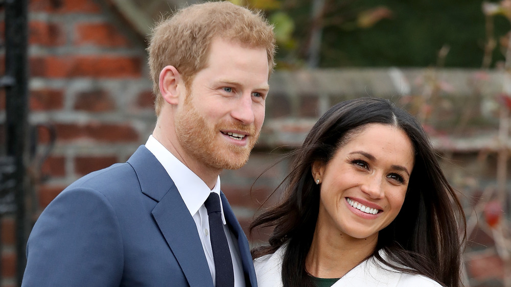 El príncipe Harry y Meghan Markle sonriendo