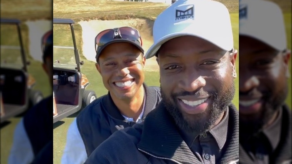 Dwyane Wade Tiger Woods sonriendo