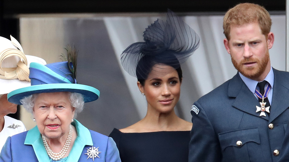 La reina Isabel II con Meghan Markle y el príncipe Harry