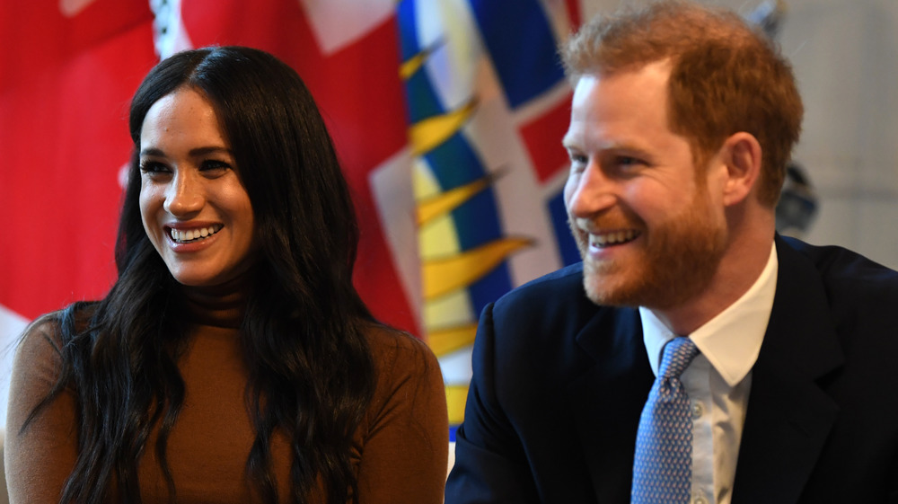 El príncipe Harry Meghan Markle riendo